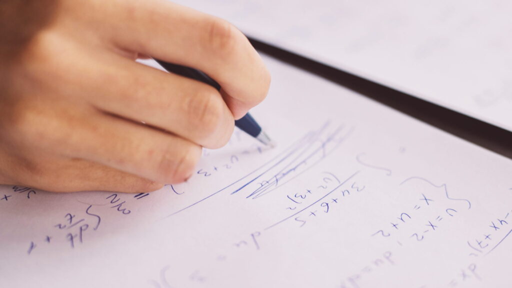 Hand writing a complex problem.